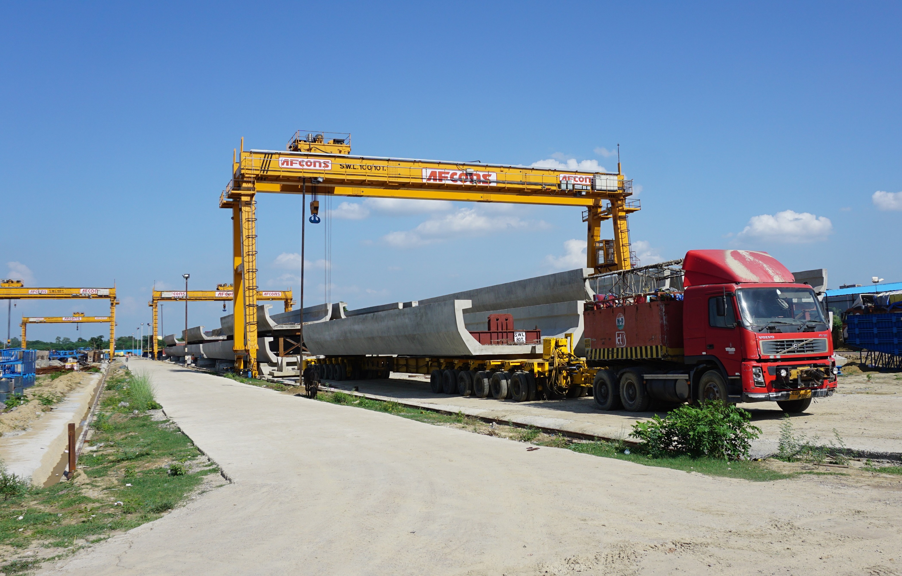 1st U-Girder for erection placed on multi-axle trailer at Casting Yard for trial runs