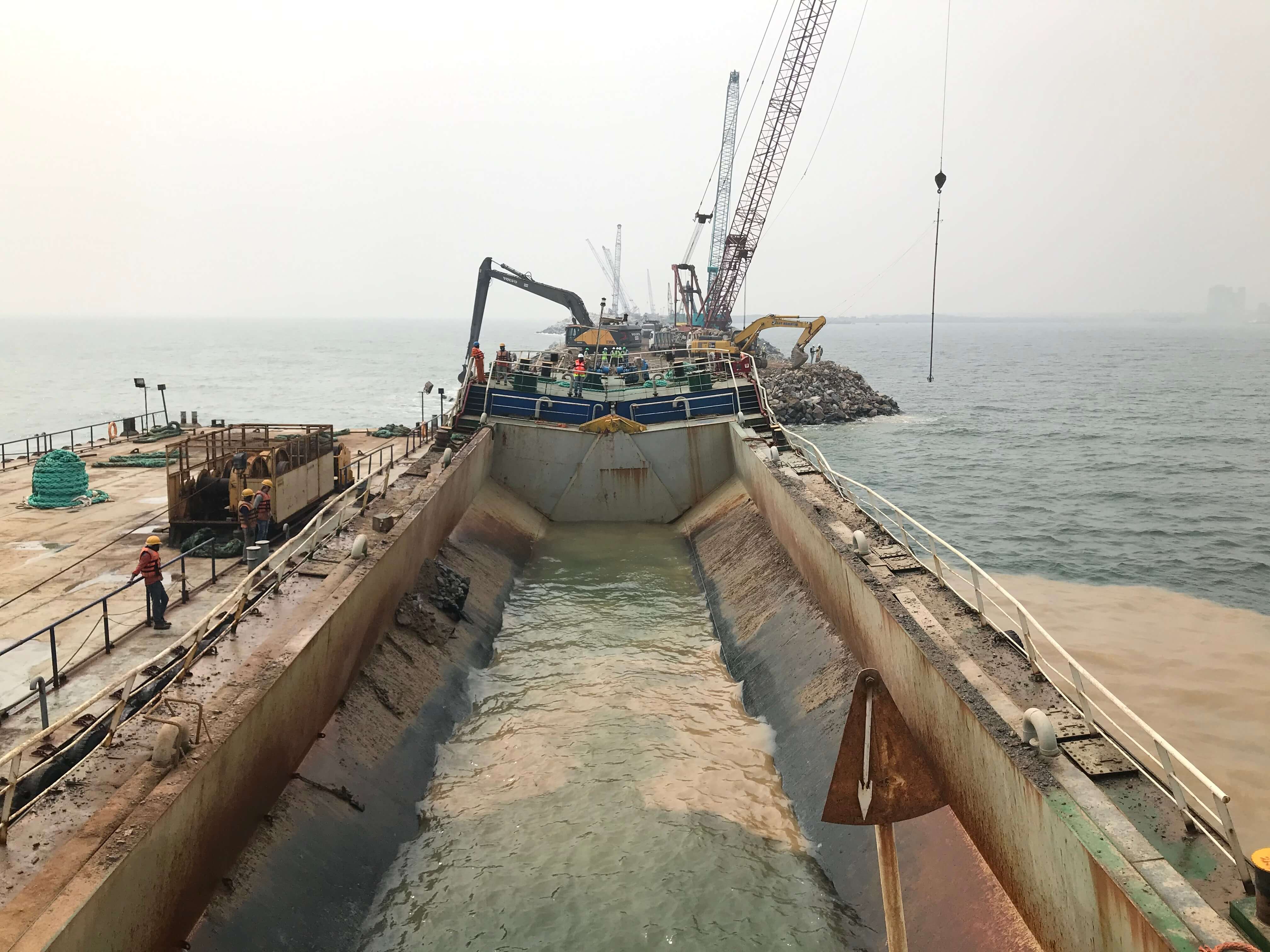 Substantial time was saved by using a Split-Hopper barge, which was used for <br /> marine dumping through GPS to build the intermediate breakwater