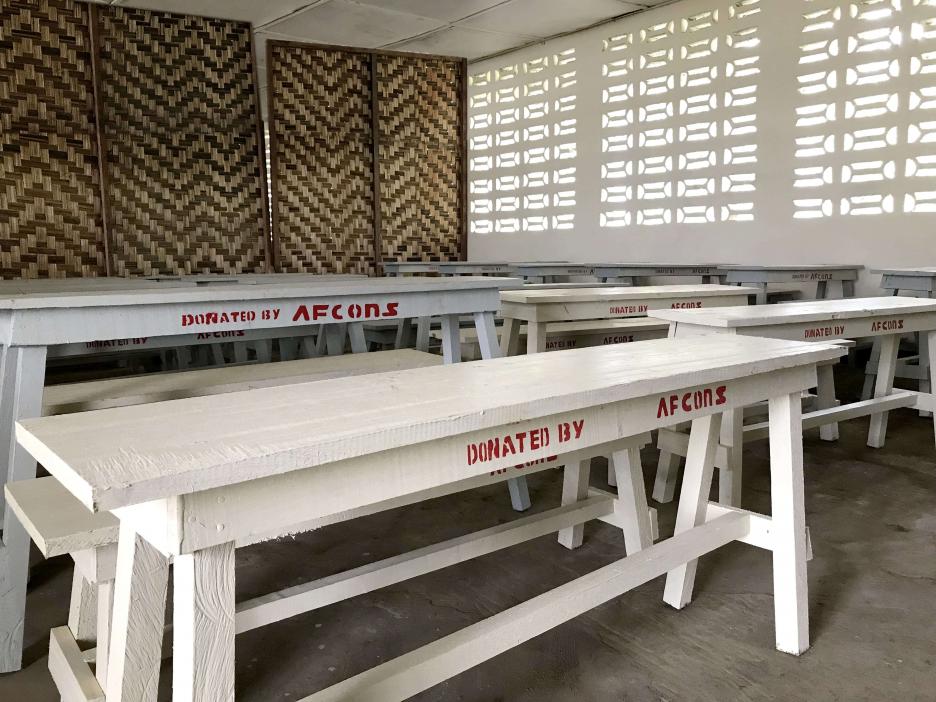 Benches and desks donated at government schools