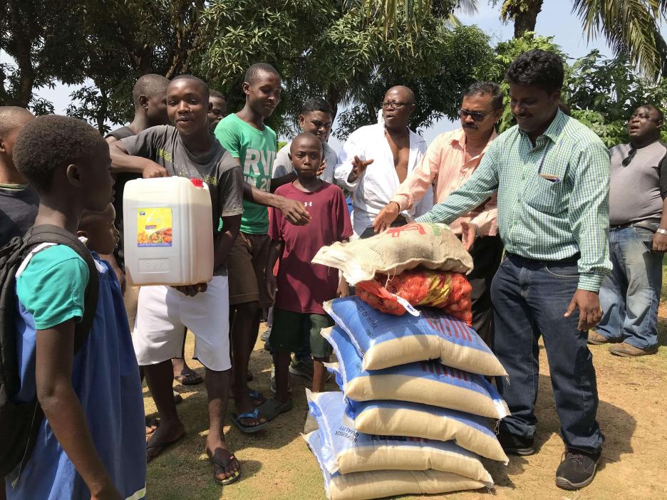 Food grains and other edible items being distributed at an orphanage in Liberia
