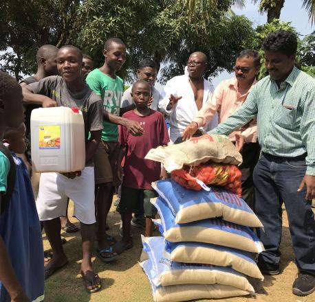 Food grains and other edible items being distributed at an orphanage in Liberia